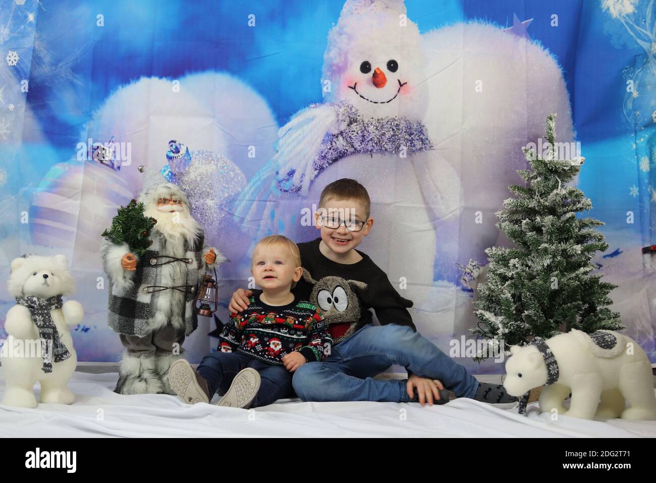 A traditional happy family Christmas photoshoot with a Christmas