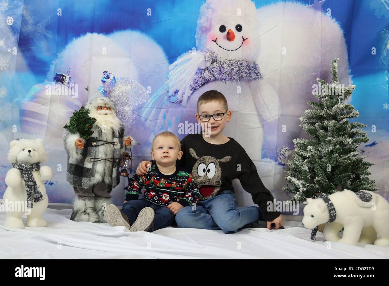 A traditional happy family Christmas photoshoot with a Christmas