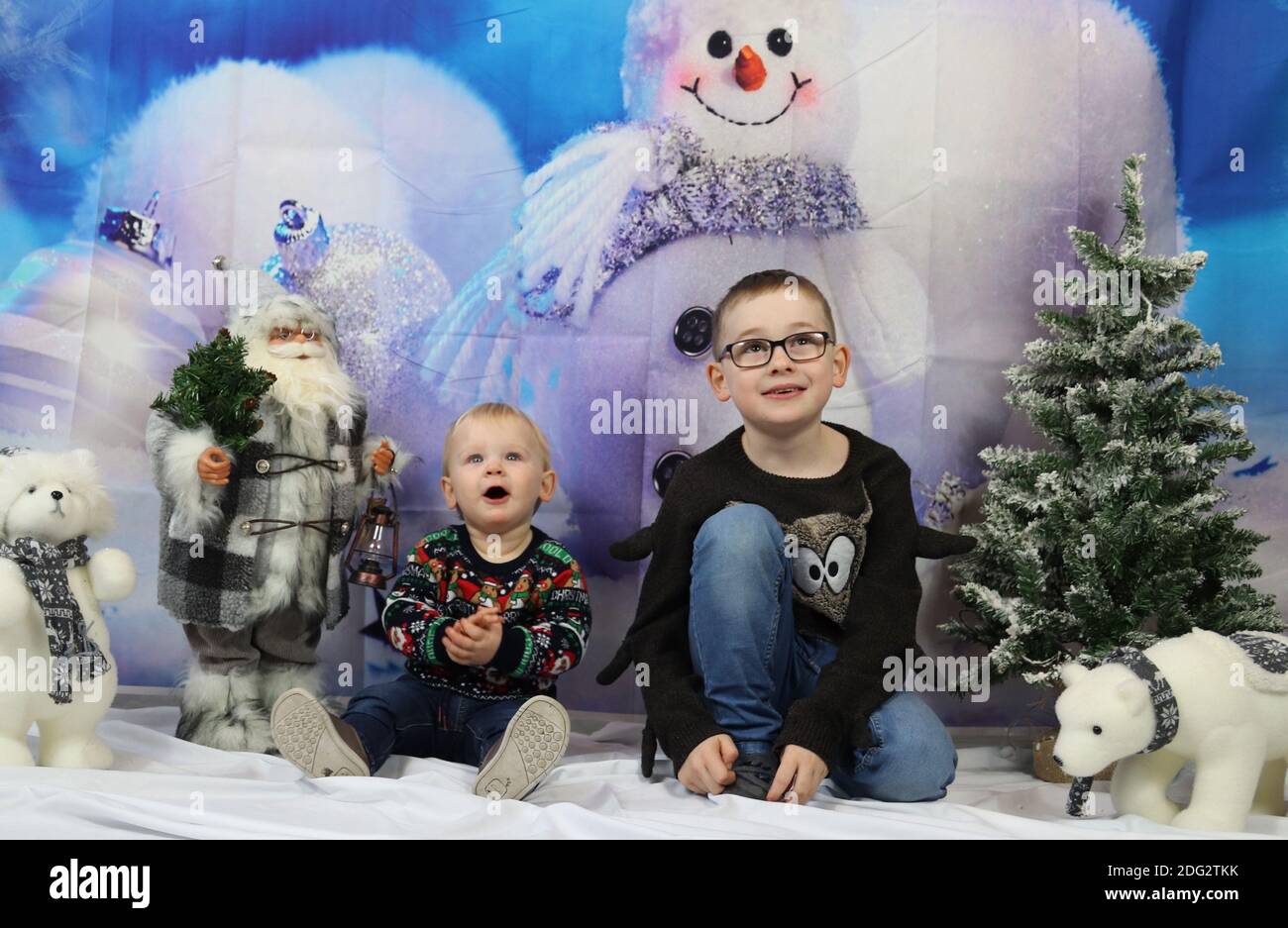 A traditional happy family Christmas photoshoot with a Christmas