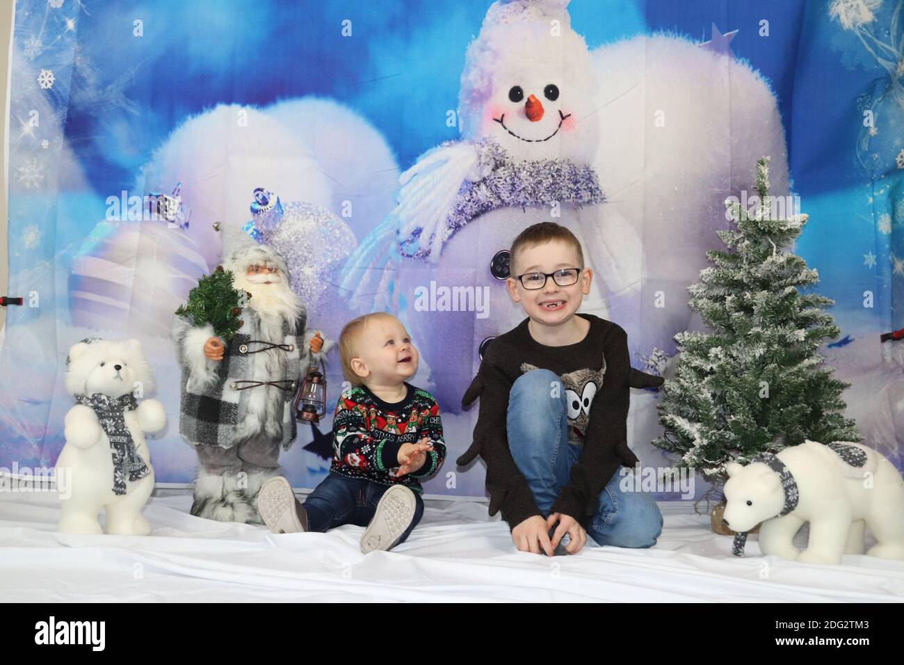 A traditional happy family Christmas photoshoot with a Christmas