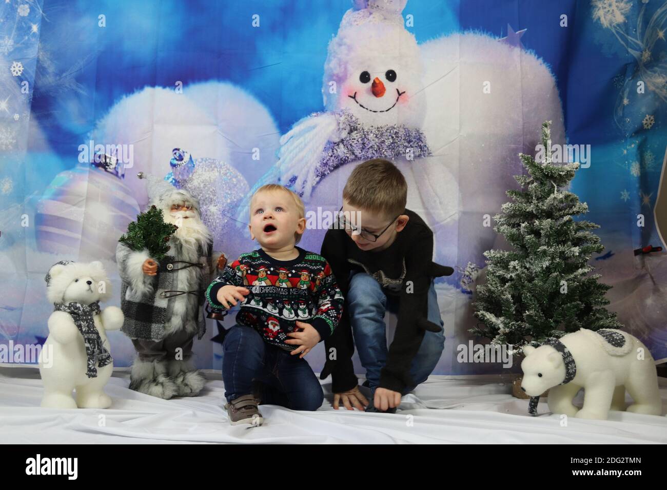 A traditional happy family Christmas photoshoot with a Christmas