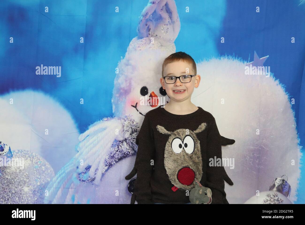 A traditional happy family Christmas photoshoot with a Christmas