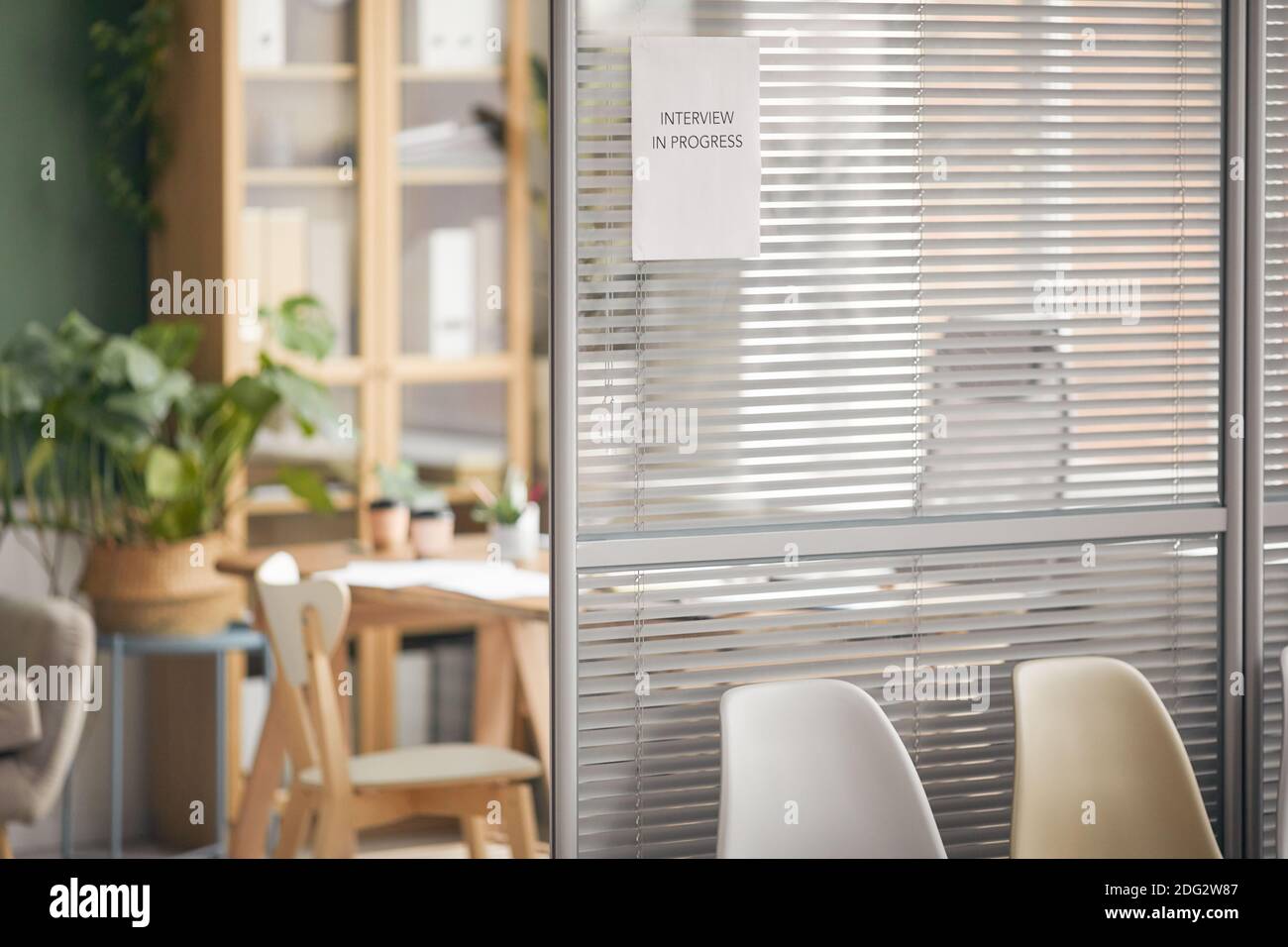 Background image of empty office room with sign Interview in progress on  glass wall, copy space Stock Photo - Alamy