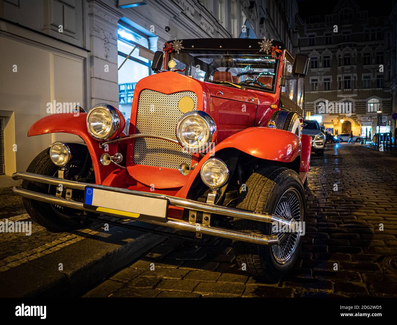 Red old vintage classic car on the night street Stock Photo