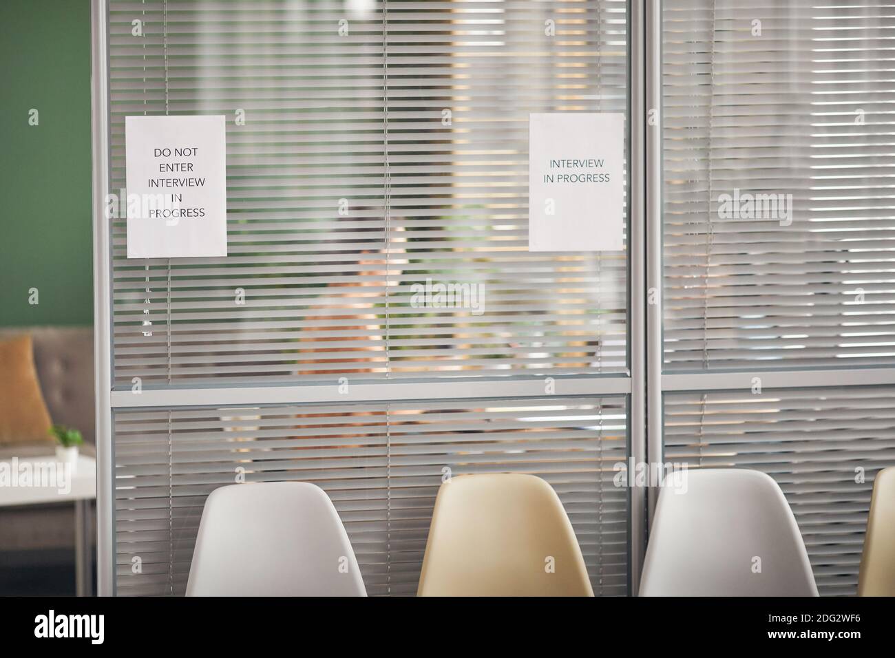 Background image of office room with sign Interview in progress on glass  wall and silhouettes of people, copy space Stock Photo - Alamy