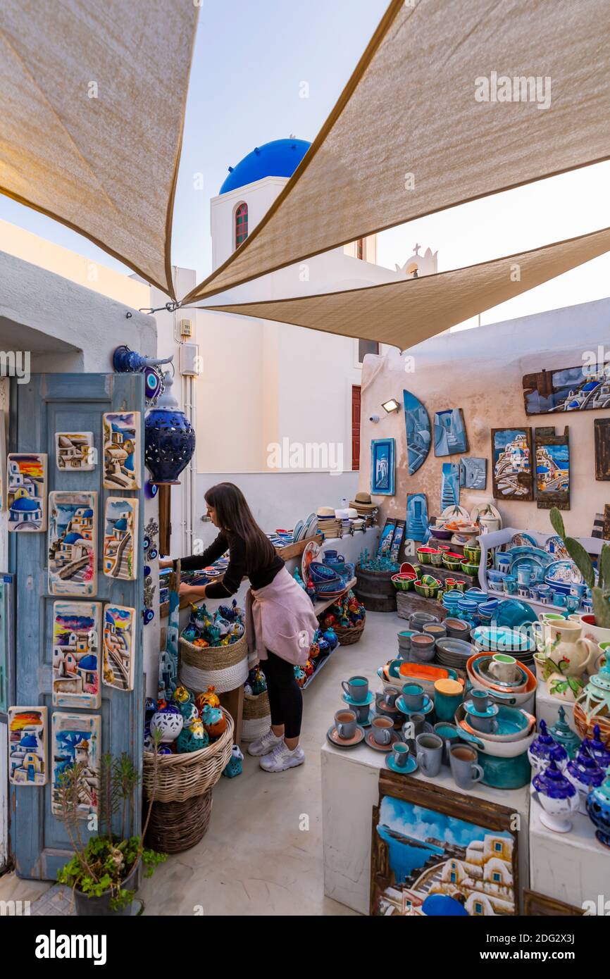 View of souvenir pottery and painted pictures shop in Oia, Santorini, Greek Islands, Greece, Europe Stock Photo