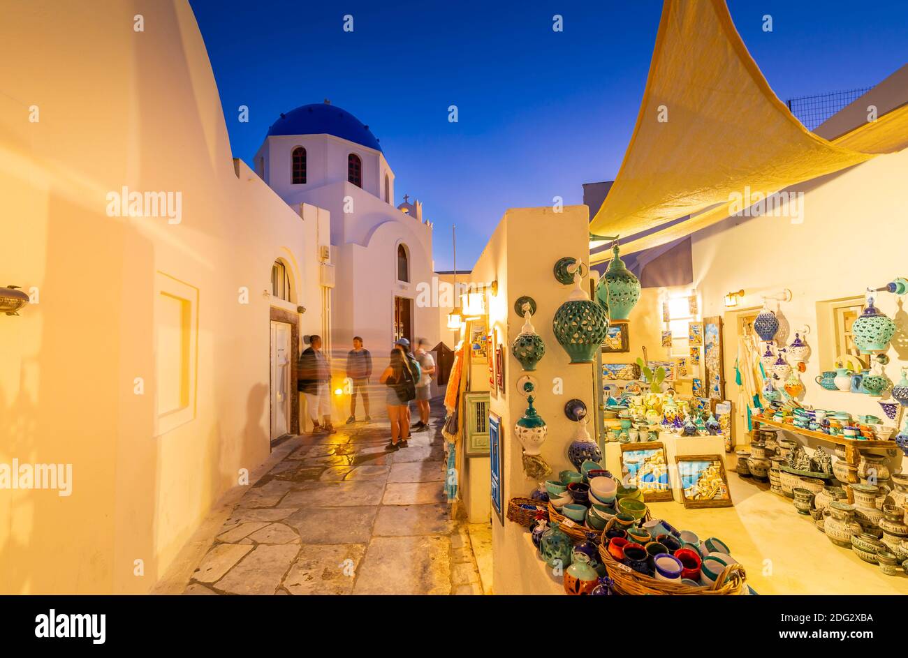 View of church and souvenir shop in Oia at dusk, Santorini, Greek Islands, Greece, Europe Stock Photo