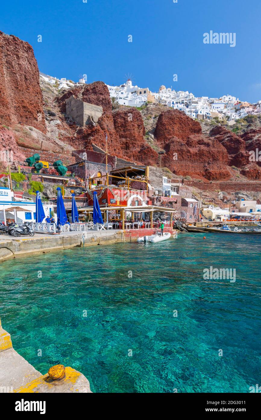View of little harbour and cliff top Oia village, Santorini, Aegean Island, Cyclades Island, Greek Islands, Greece, Europe Stock Photo