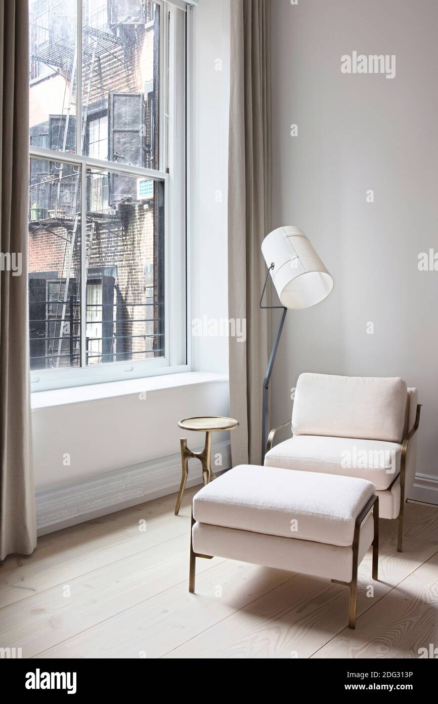 White armchair and footstool Stock Photo Alamy