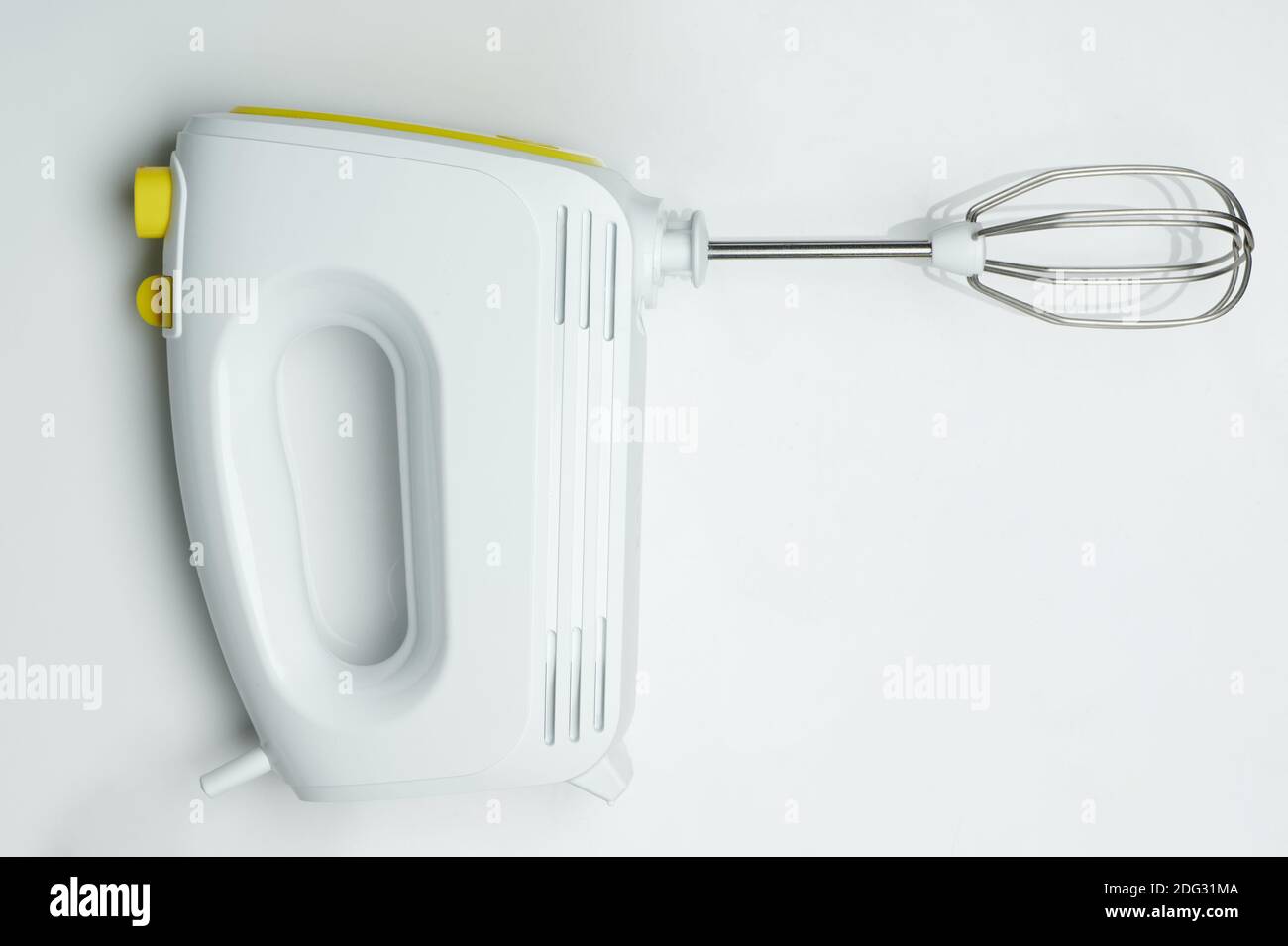 Side view of modern hand mixer isolated on studio background Stock Photo