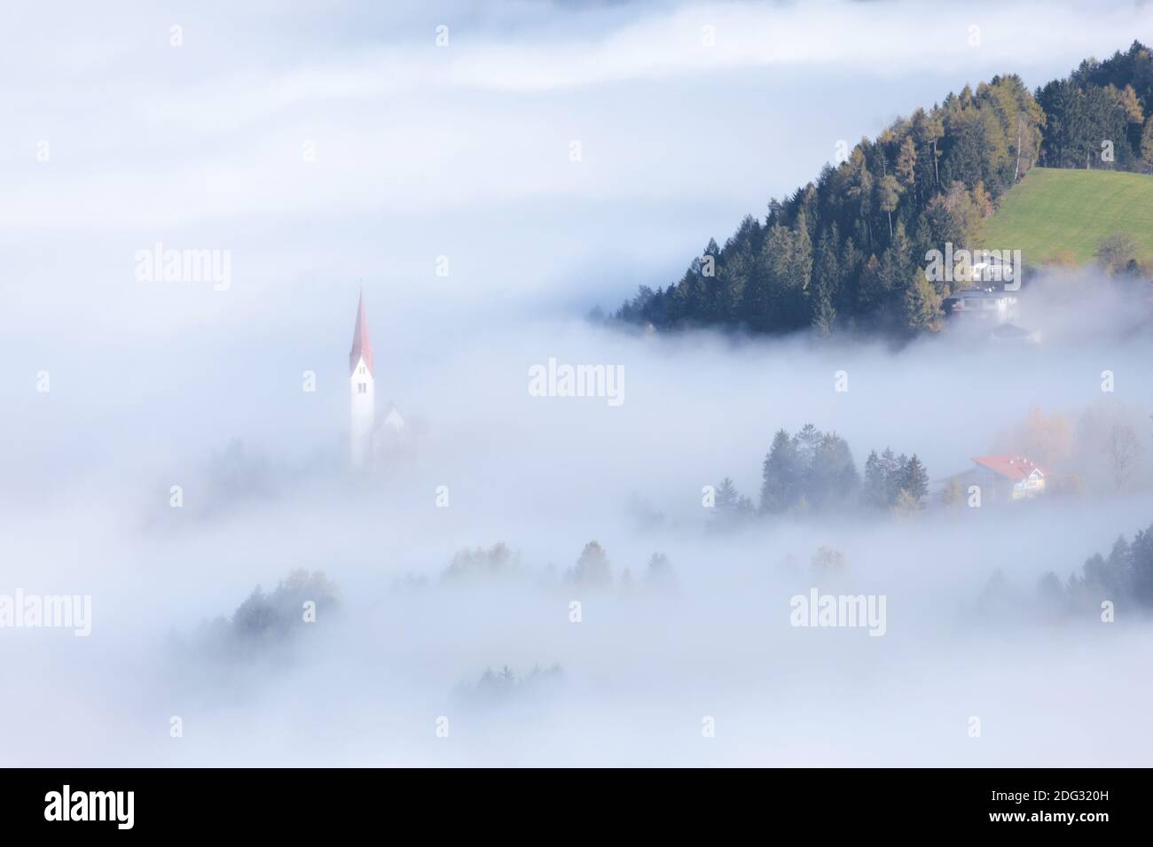 Church spire in the fog Stock Photo