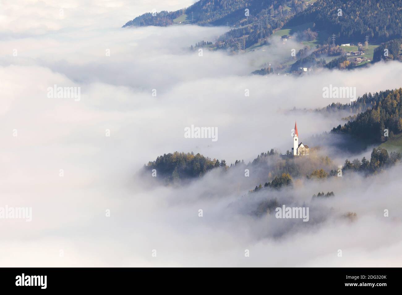Church spire in the fog, Tyrol Stock Photo