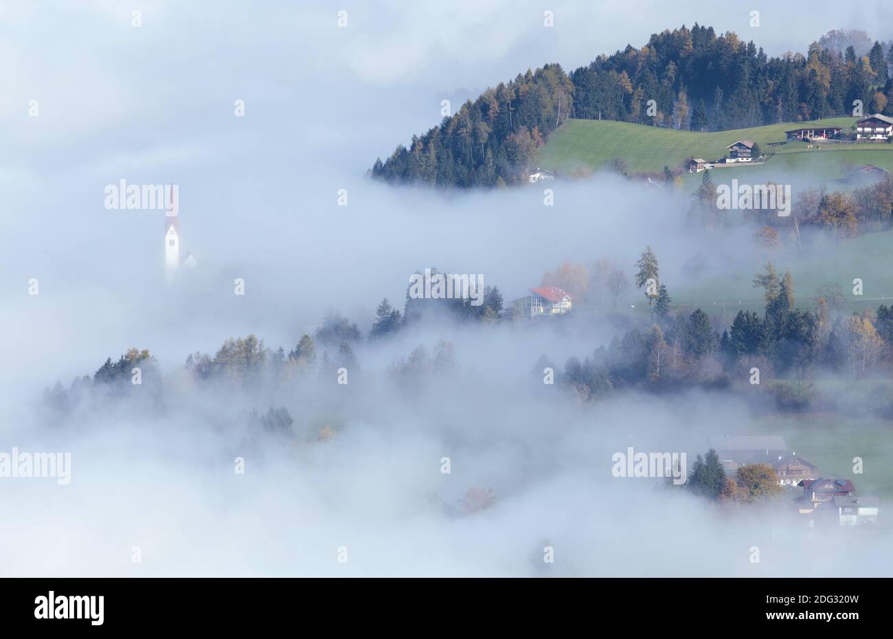 The Church of St. Peter in the fog, Weerberg Stock Photo