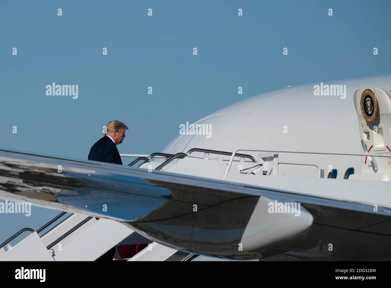 U.S. President Donald Trump boards Air Force One at Joint Base Andrews in Maryland, U.S., on Saturday, Oct. 17, 2020. Trump is expected to make multiple campaign stops on the West coast over the next few days, resting over night in Las Vegas, Nevada. Credit: Alex Edelman/The Photo Access Stock Photo