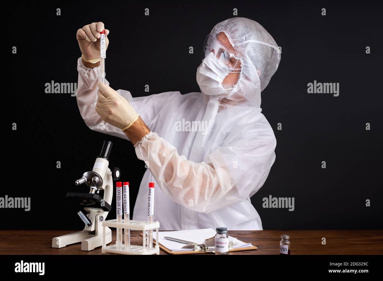 male scientist is testing a sample of biological tubes contaminated by ...