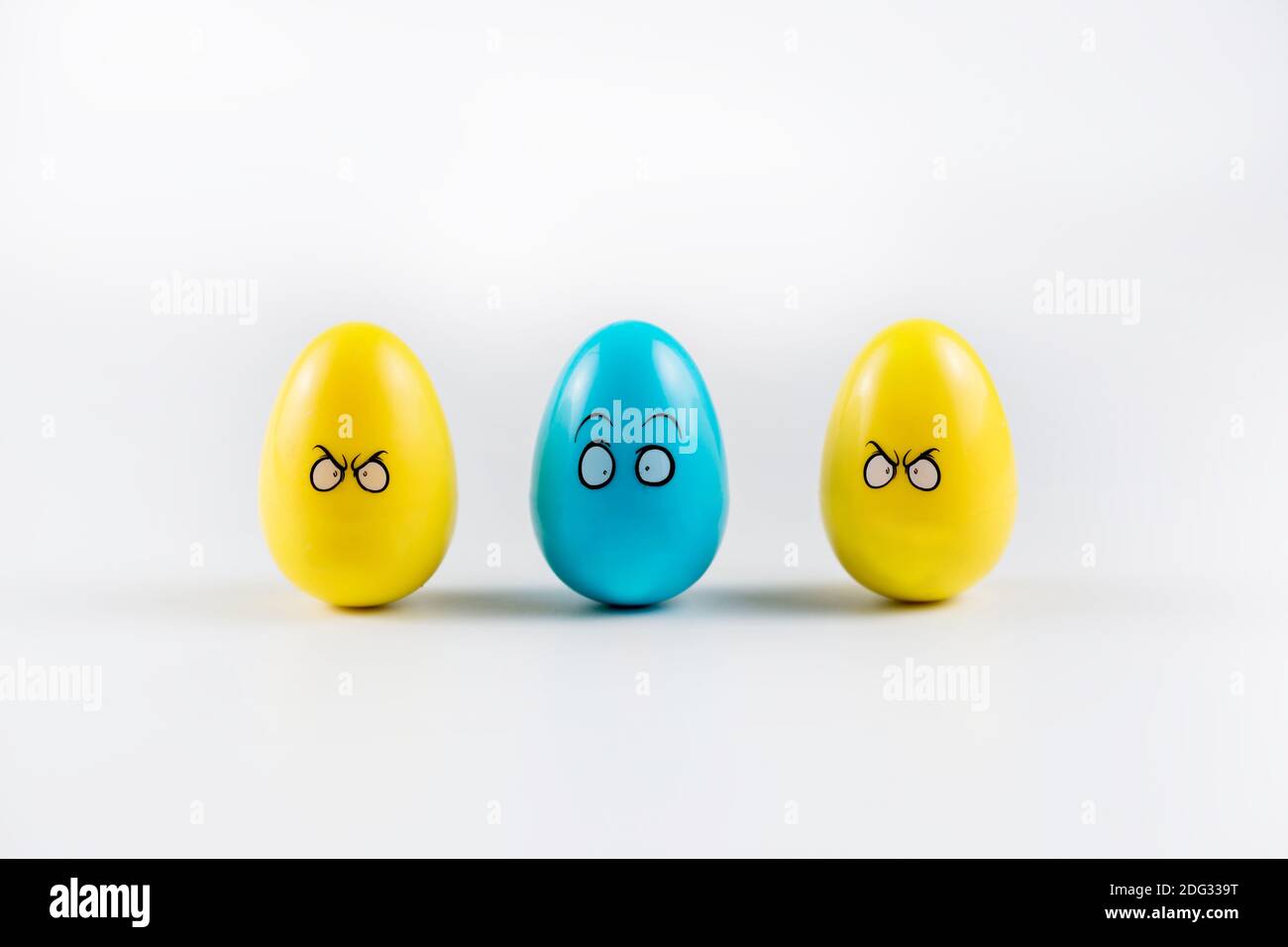 Three Colorful Plastic Easter Eggs on white background. Stock Photo