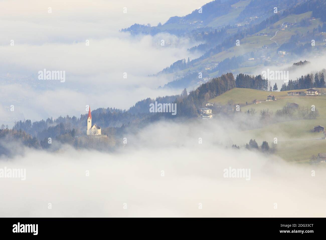 The Church of St. Peter in the fog, Weerberg Stock Photo