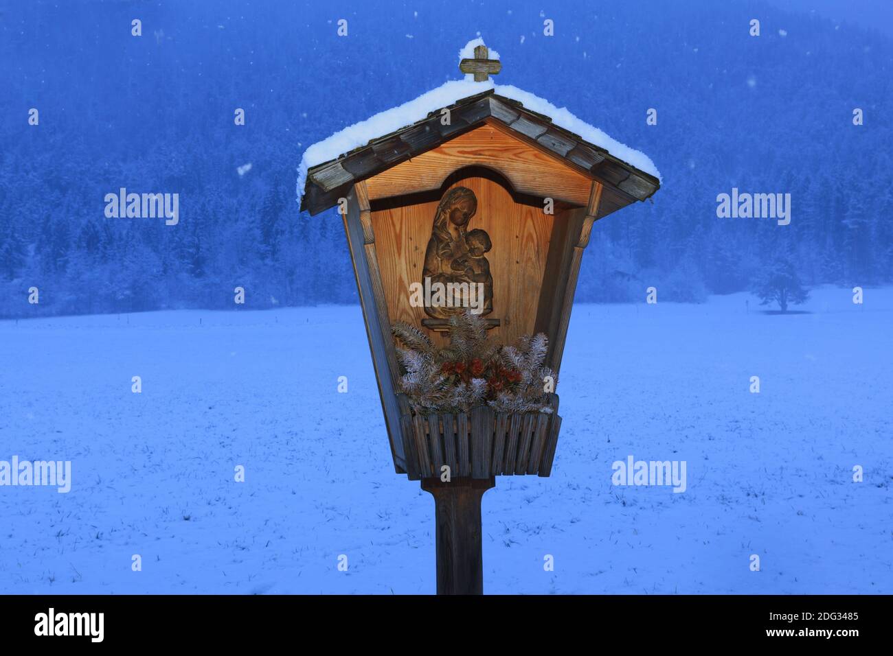 Snow-covered cross in winter Stock Photo