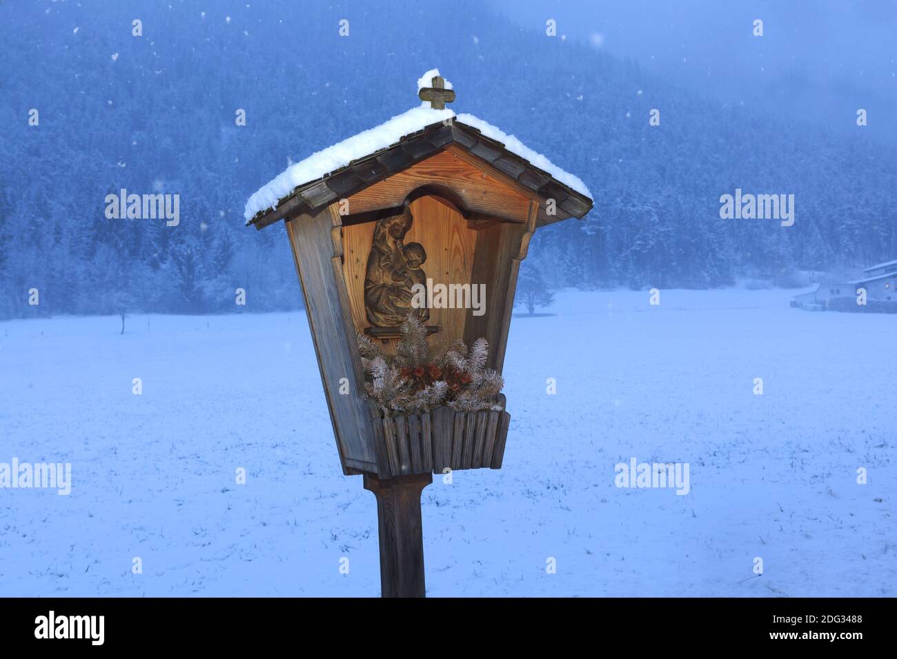 Snow-covered cross in winter Stock Photo