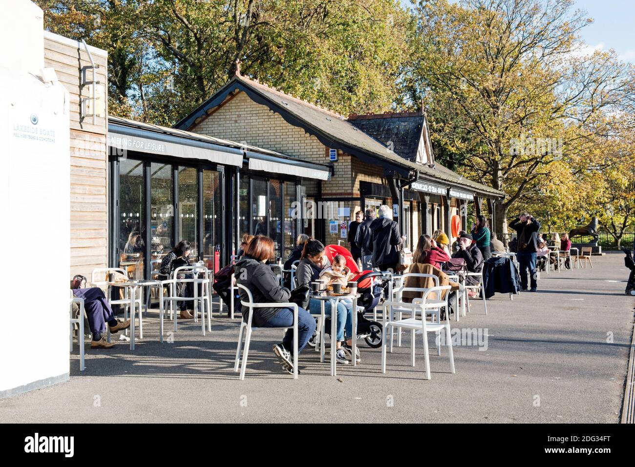 Lakeside Café Alexandra Palace Park with people eating outside in Autumn, London Borough of Haringey Stock Photo