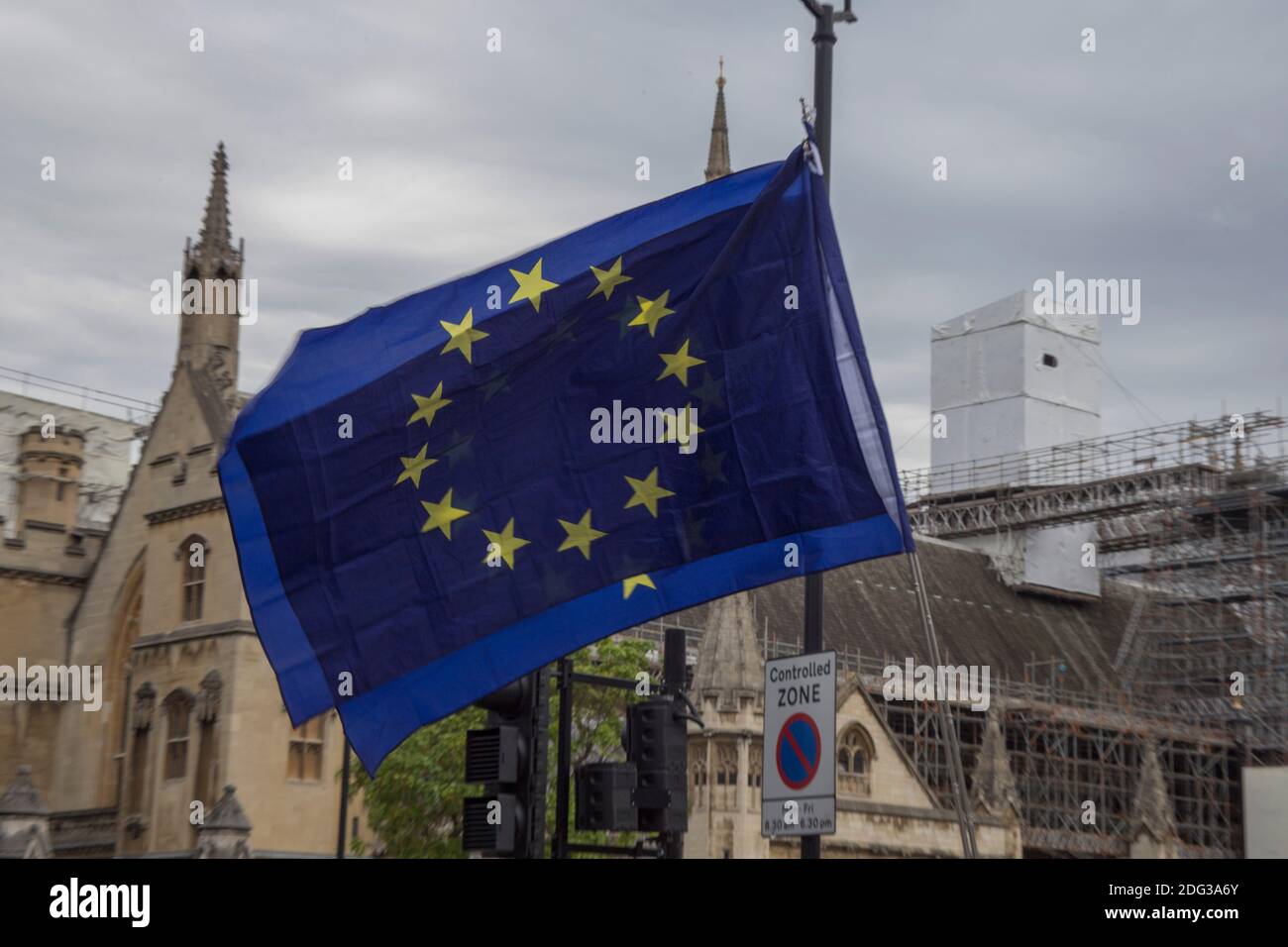 European Union Flag against the background of UK’s houses of parliment (under renovatios) as part of an anti-Brexit campaign Stock Photo