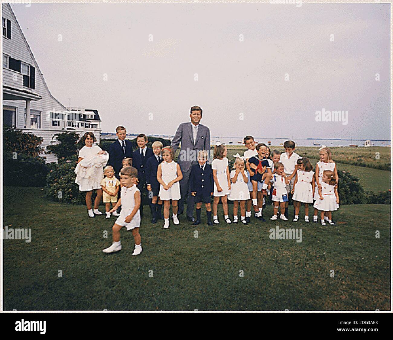 Hyannisport, MA, - Hyannisport Weekend August 3, 1963 -- President Kennedy with children. Kathleen Kennedy (holding Christopher Kennedy) Edward Kennedy Jr., Joseph P. Kennedy II, Kara Kennedy, Robert F. Kennedy Jr., David Kennedy, Caroline Kennedy, President Kennedy, Michael Kennedy, Courtney Kennedy, Kerry Kennedy, Bobby Shriver (holding Timothy Shriver), Maria Shriver, Steve Smith Jr., Willie Smith, Christopher Lawford, Victoria Lawford, Sidney Lawford, Robin Lawford (in foreground- John F. Kennedy Jr.) Photo by Cecil Stoughton - The White House via CNP Stock Photo