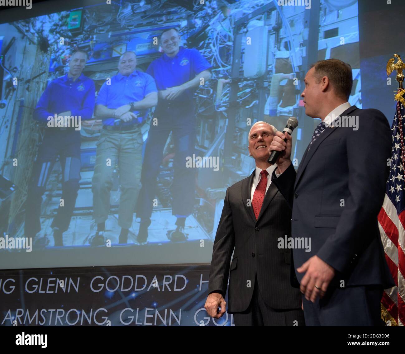 U.S. Vice President Mike Pence (left) and NASA Administrator Jim Bridenstine speak to NASA astronauts Scott Tingle, Andrew Feustel and Ricky Arnold aboard the International Space Station at the NASA Headquarters April 23, 2018 in Washington, DC. Stock Photo