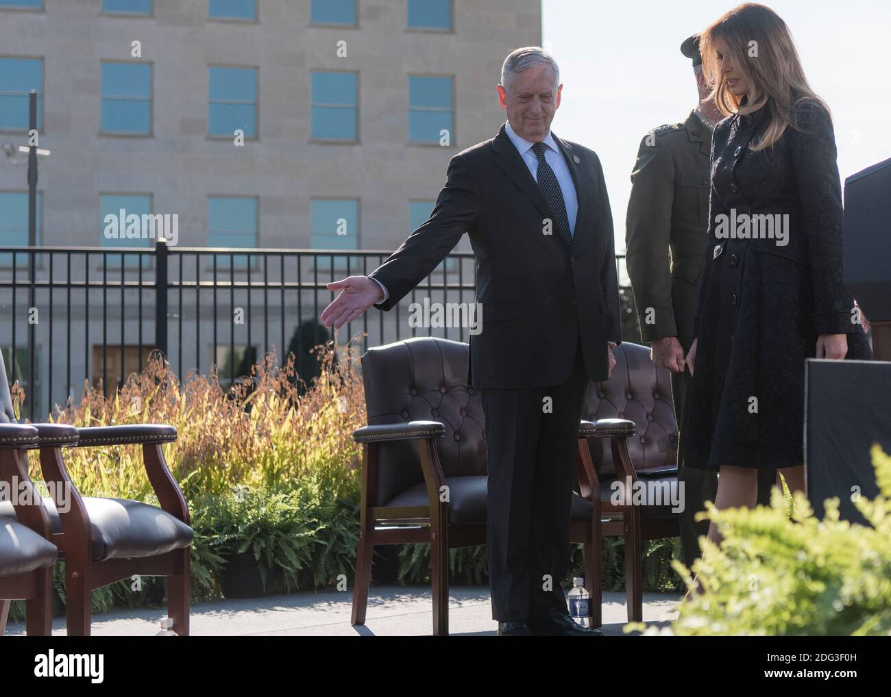 U.S. Defense Secretary James Mattis, left, shows First Lady Melania Trump her seat for the 9/11 Observance Ceremony at the Pentagon September 11, 2017 in Washington, DC. Stock Photo