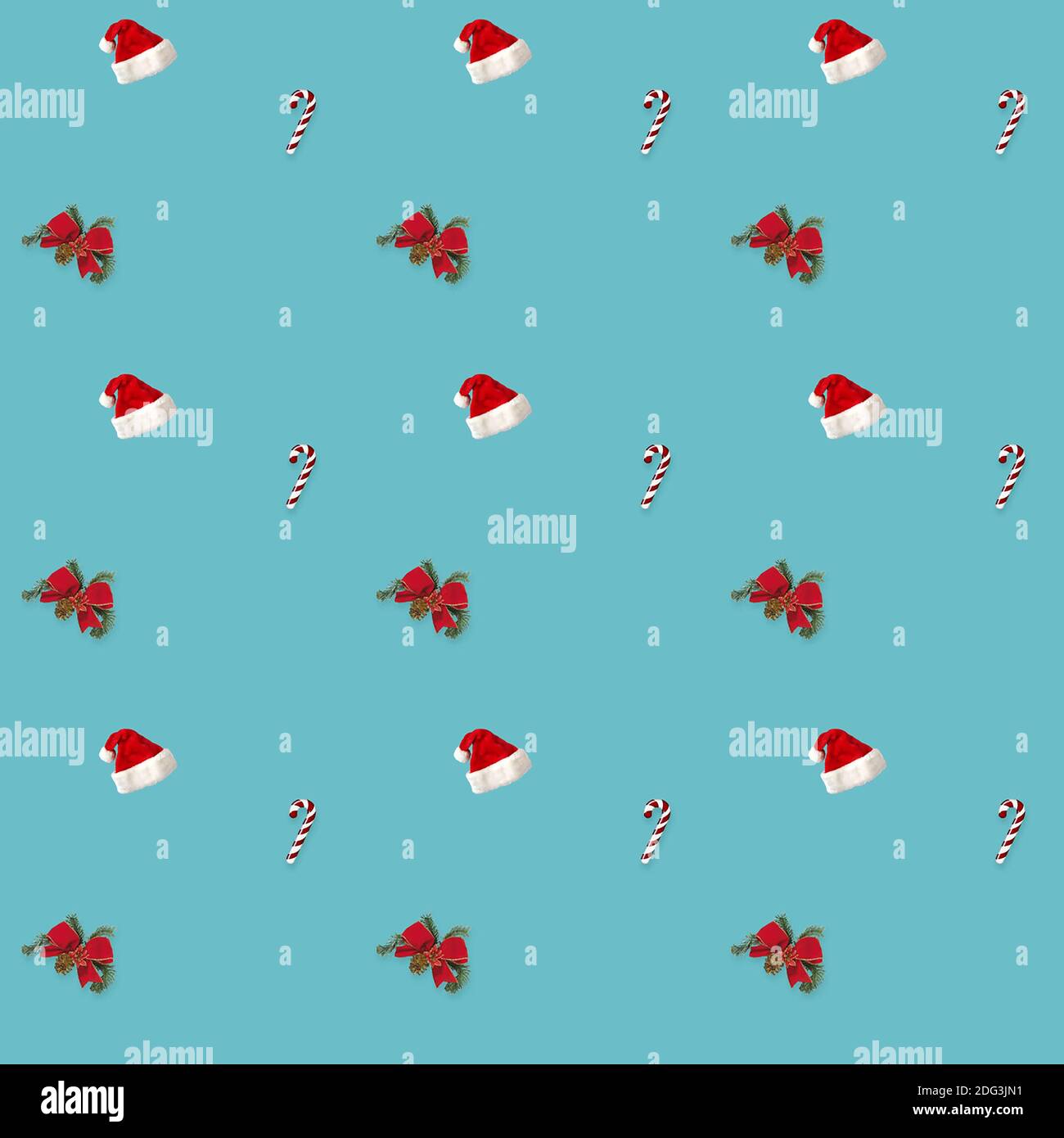 seamless pattern Santa hat, bow and candy cane candy cane on blue background Stock Photo