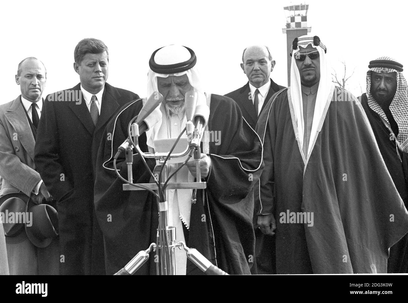 King Saud bin Abdulaziz Al Saud of Saudi Arabia makes remarks as he is welcomed to the United States by US President John F. Kennedy during a ceremony at Andrews Air Force Base, Maryland on February 13, 1962. From left to right: unidentified, President Kennedy, King Saud, US Secretary of State Dean Rusk, unidentified, and unidentified.Photo by Arnie Sachs / CNP /ABACAPRESS.COM Stock Photo