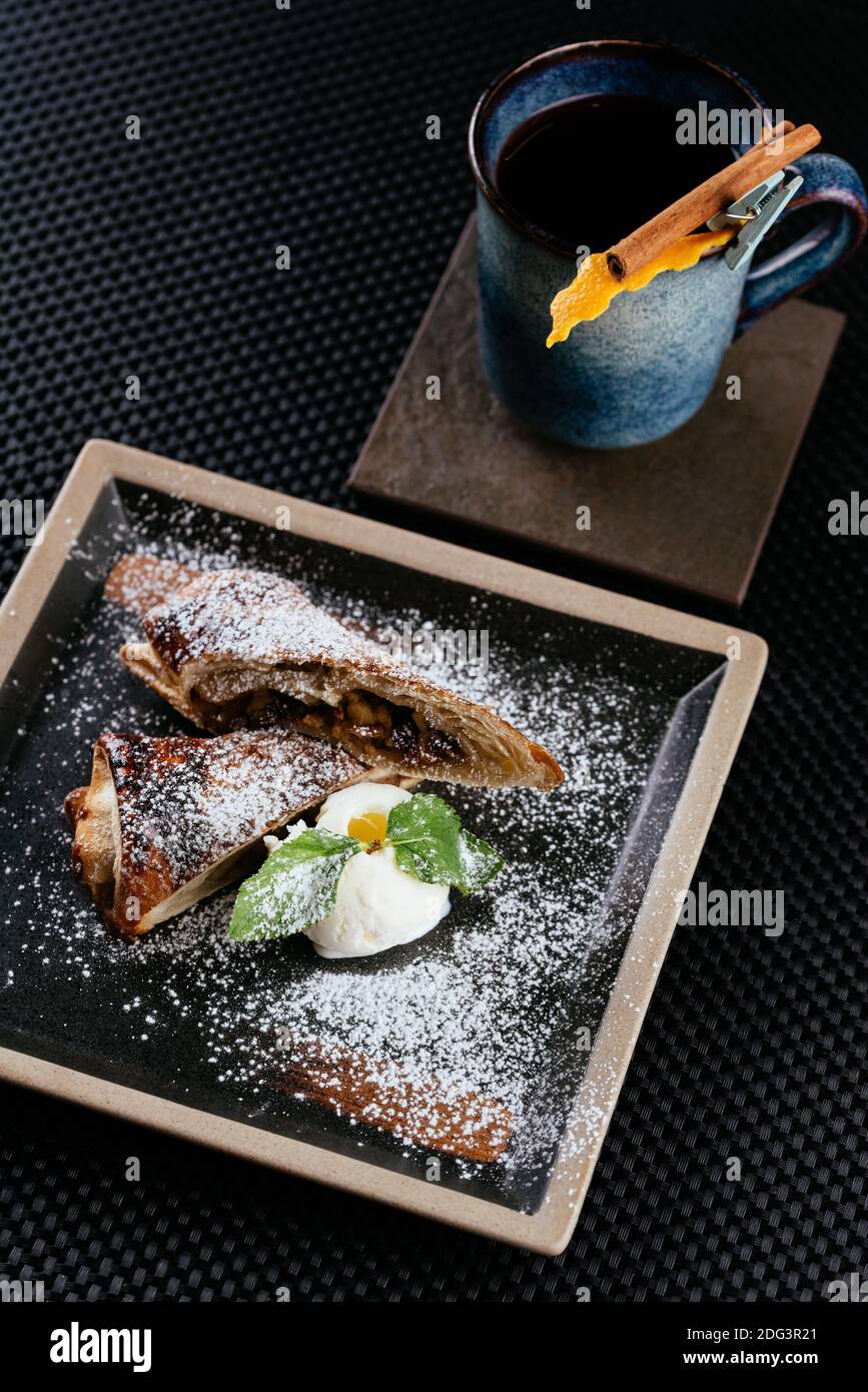 various desserts with tea on a black background Stock Photo
