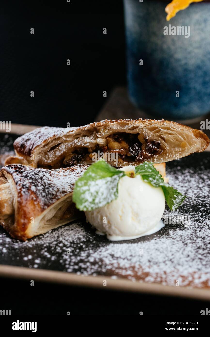 various desserts with tea on a black background Stock Photo