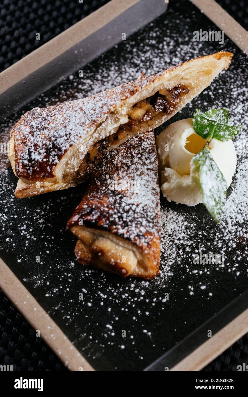 various desserts with tea on a black background Stock Photo