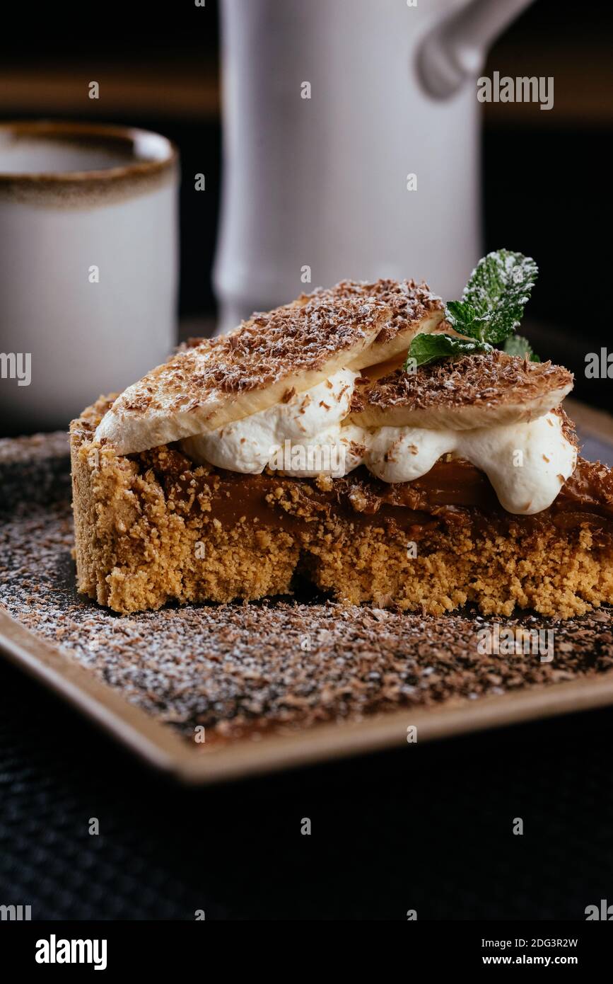 various desserts with tea on a black background Stock Photo