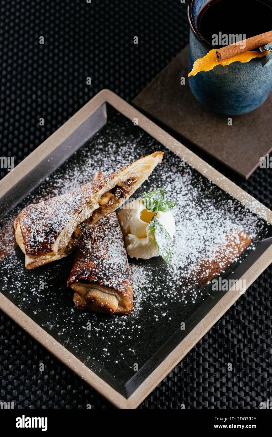 various desserts with tea on a black background Stock Photo