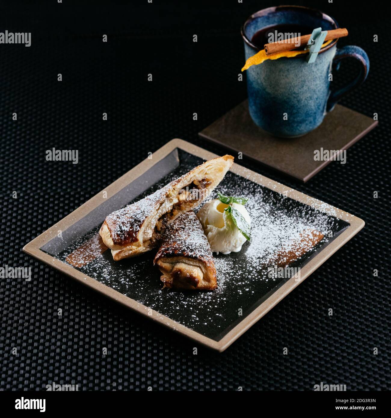 various desserts with tea on a black background Stock Photo