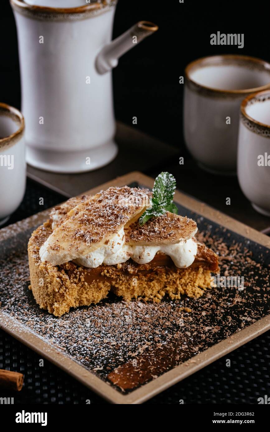 various desserts with tea on a black background Stock Photo
