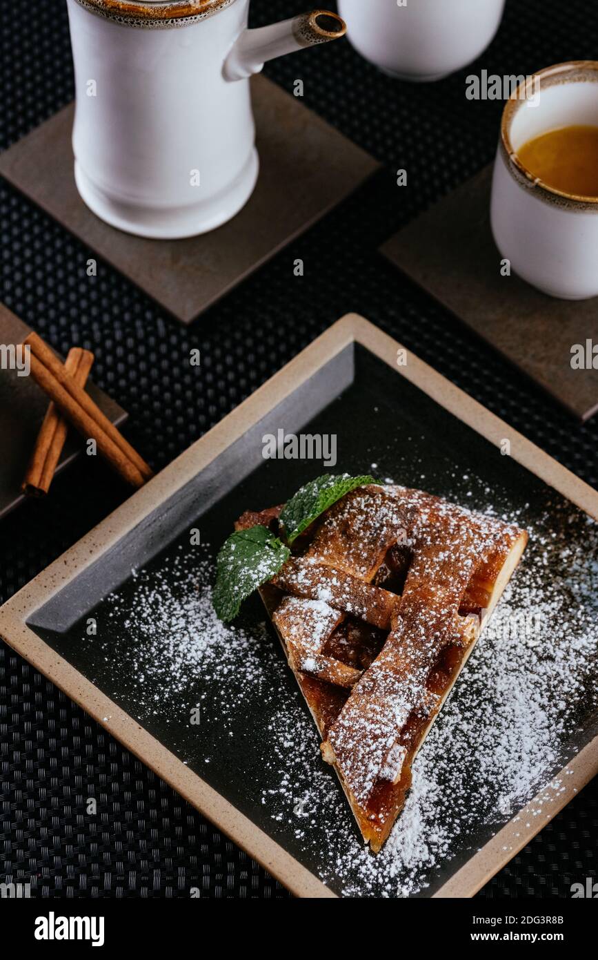various desserts with tea on a black background Stock Photo