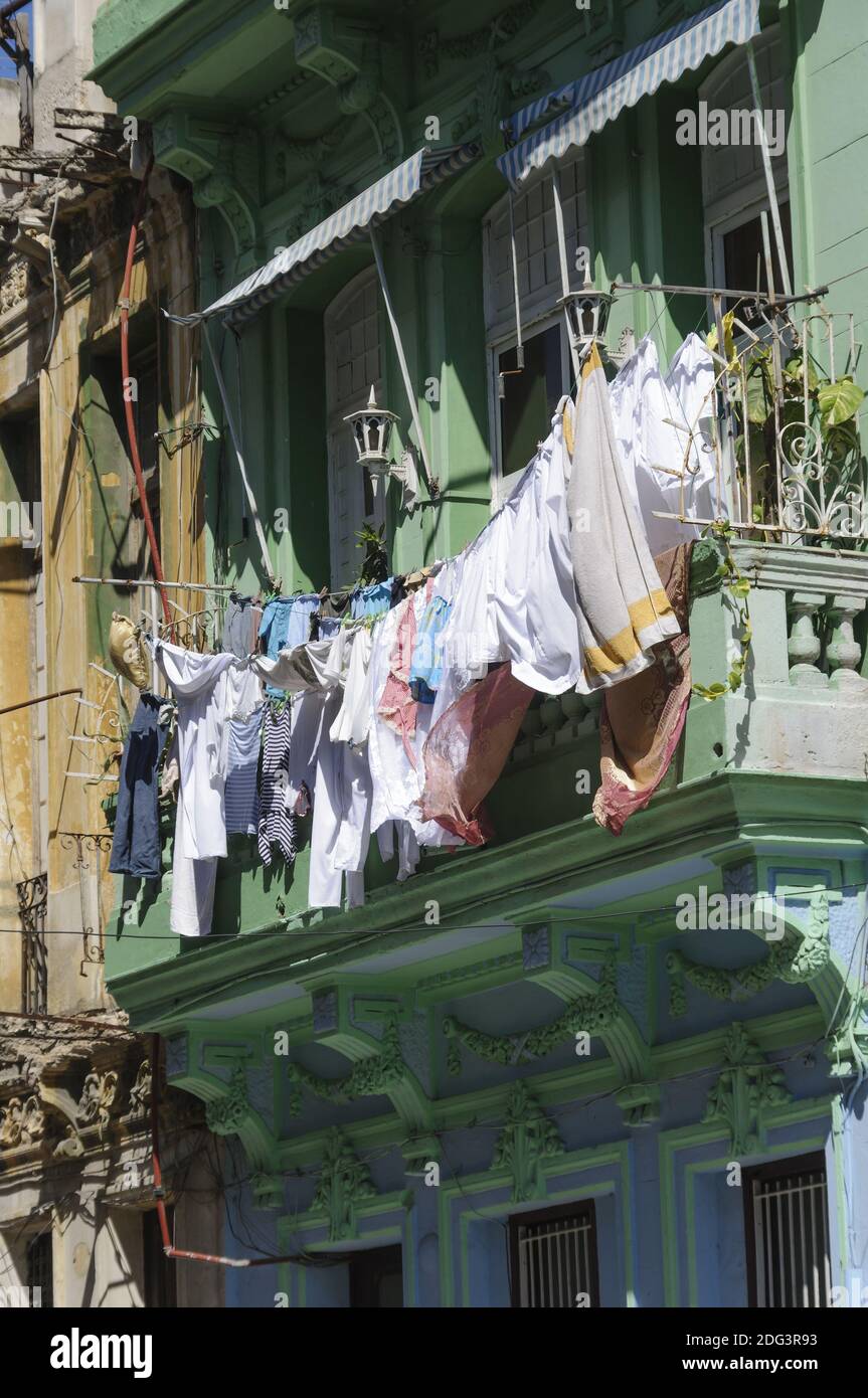 Old house with balcony on the clothes on the line depends. Stock Photo