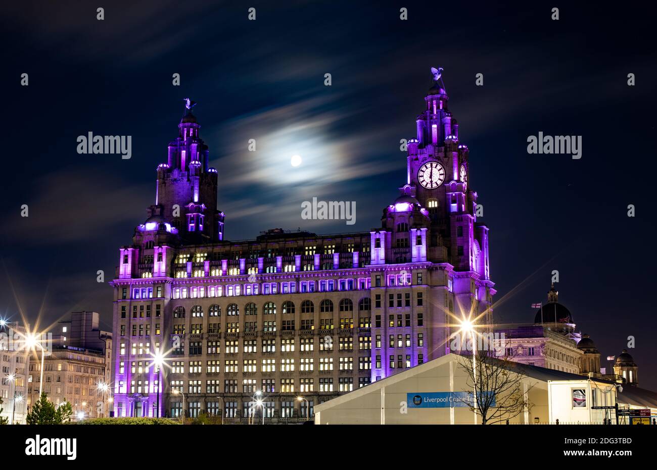 The Royal Liver Building in Liverpool shines different colours throughout the night Stock Photo