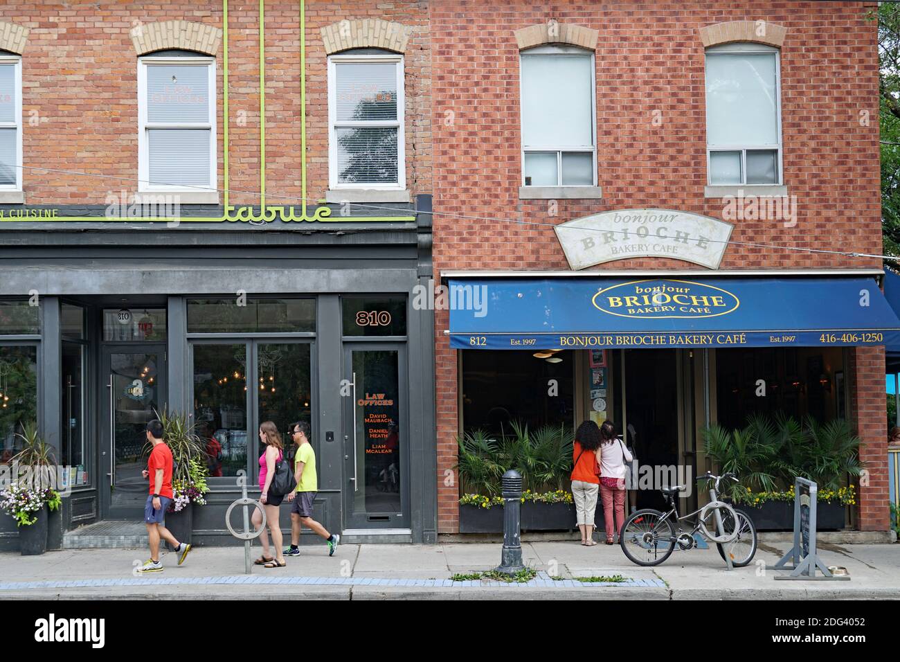 Toronto, Canada July 28, 2019 People stroll on Queen Street Easst in