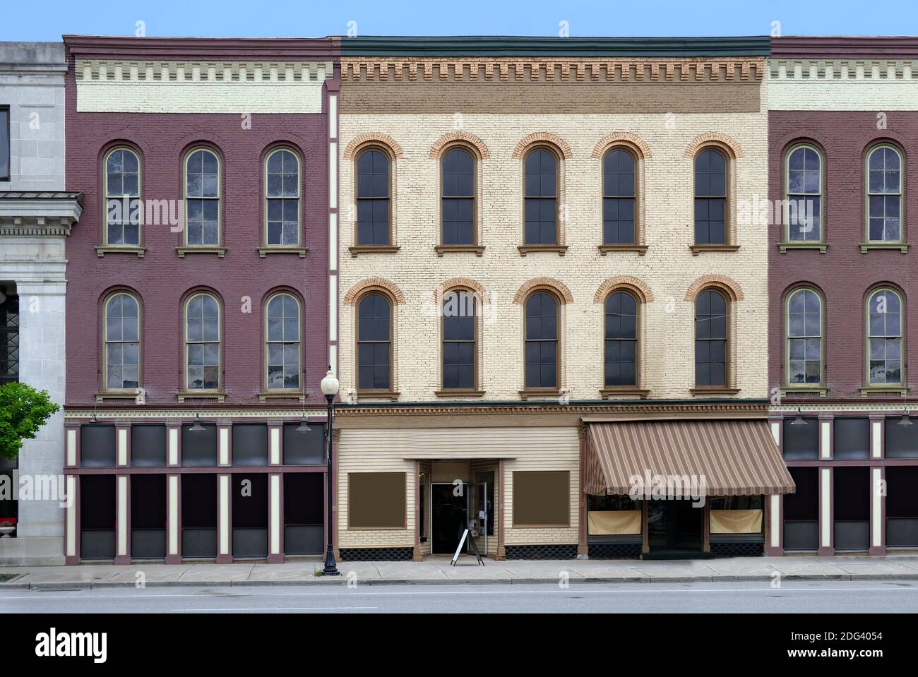 old fashioned small town main street facade with painted brick buildings Stock Photo