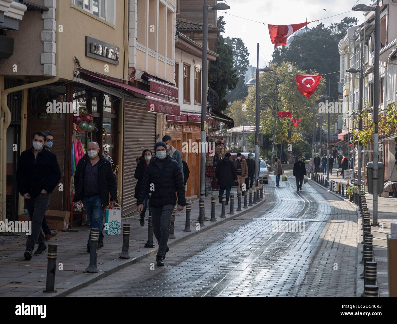 Sile, Turkey. 7th Dec, 2020. People walk in Sile, a small fishing town some 70 km from Istanbul, Turkey, on Dec. 7, 2020. The concerns with the COVID-19 pandemic are causing more and more residents in Turkey's largest city Istanbul to move to the city's remote seaside districts along the shores of the Black Sea and the Marmara Sea. Credit: Osman Orsal/Xinhua/Alamy Live News Stock Photo