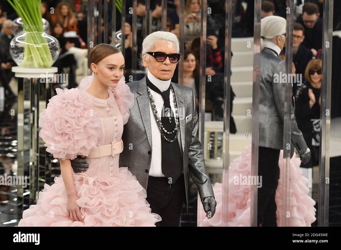 Lily-Rose Depp and Karl Lagerfeld walk on the runway during the