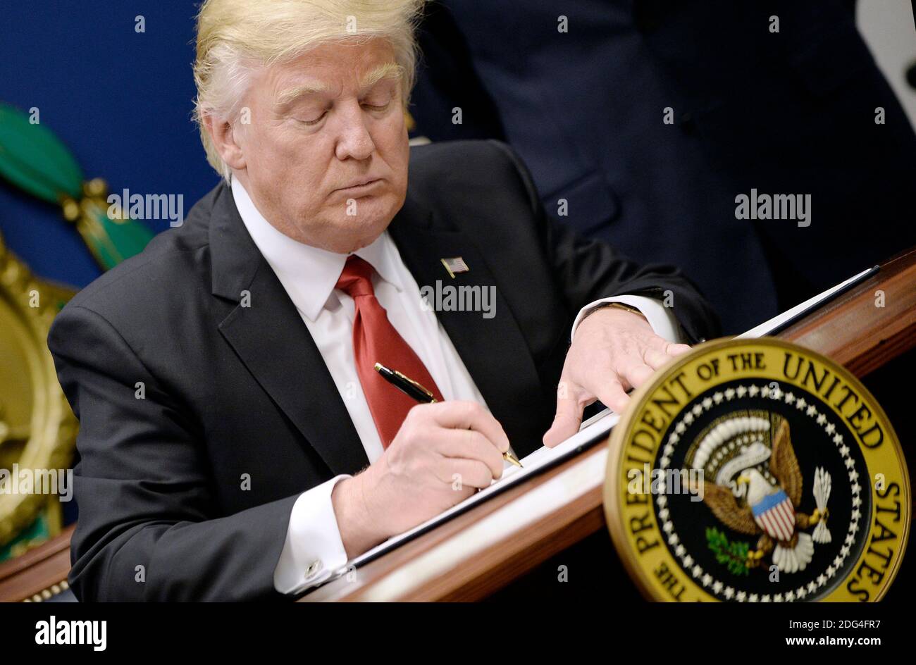 US President Donald Trump signs Executive Orders in the Hall of Heroes at the Department of Defense in Virginia, January 27, 2017. Photo by Olivier Douliery/Abaca Stock Photo