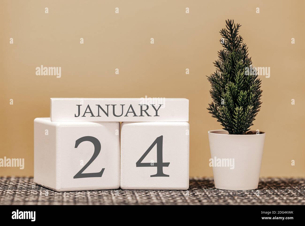 Desk calendar for use in different ideas. Winter month - January and the  number on the cubes 24. Calendar of holidays on a beige solid background  Stock Photo - Alamy