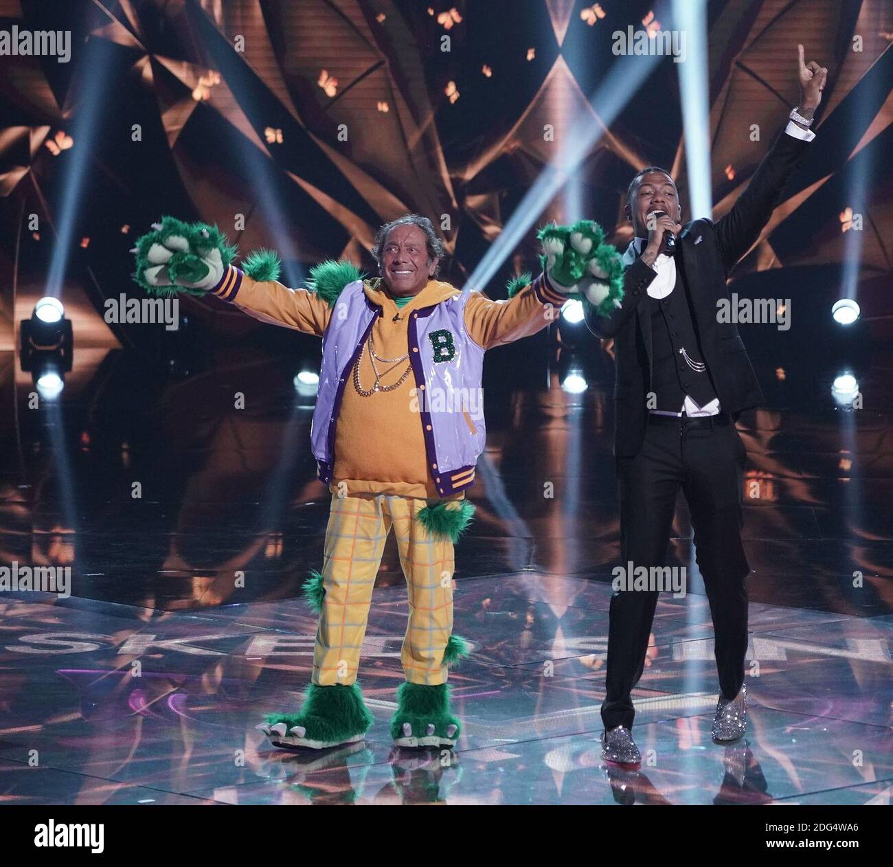 THE MASKED SINGER, from left Paul Anka (revealed as Broccoli), host