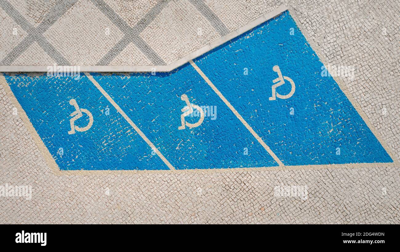 Handicap symbol on parking space. Disability car parking sign. Handicapped parking area Stock Photo