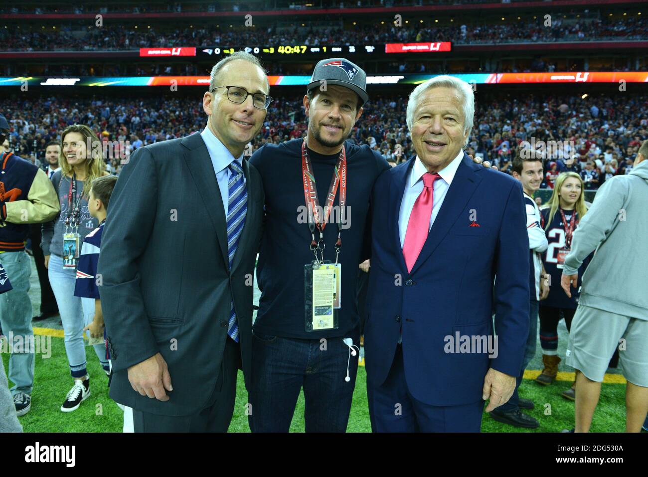 New England Patriots owner Robert Kraft (L), Denver Broncos owner Pat Bowlen  (C), and NFL commissioner Roger Goodell talk during team warm ups at Sports  Authority Field at Mile High on December