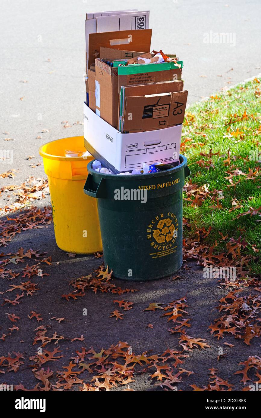PRINCETON, NJ -9 NOV 2020- View of recycling trash cans with Amazon boxes and other packaging on the street in Mercer County, New Jersey, United State Stock Photo